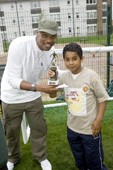 Will Smith look a like presenting trophy